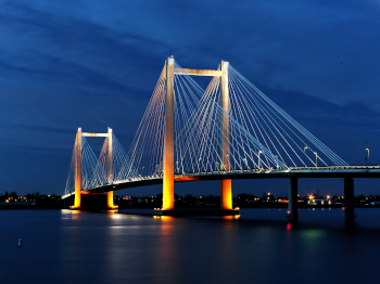 Evening shots of Benton Franklin intercounty bridge lit up over the Columbia River in Kennewick Washington.