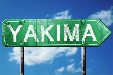 Yakima road sign on a blue sky background
