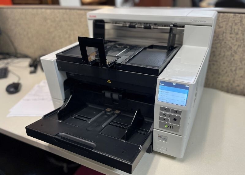 Photo of a scanner sitting on a desk surface