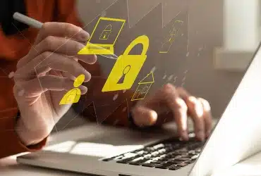 Businessman touching an icon key through the virtual screen, concept of cyber security