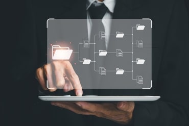 Businessman working on digital tablet document management system