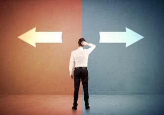 Salesman in doubt standing in front of two arrows on blue and red background concept